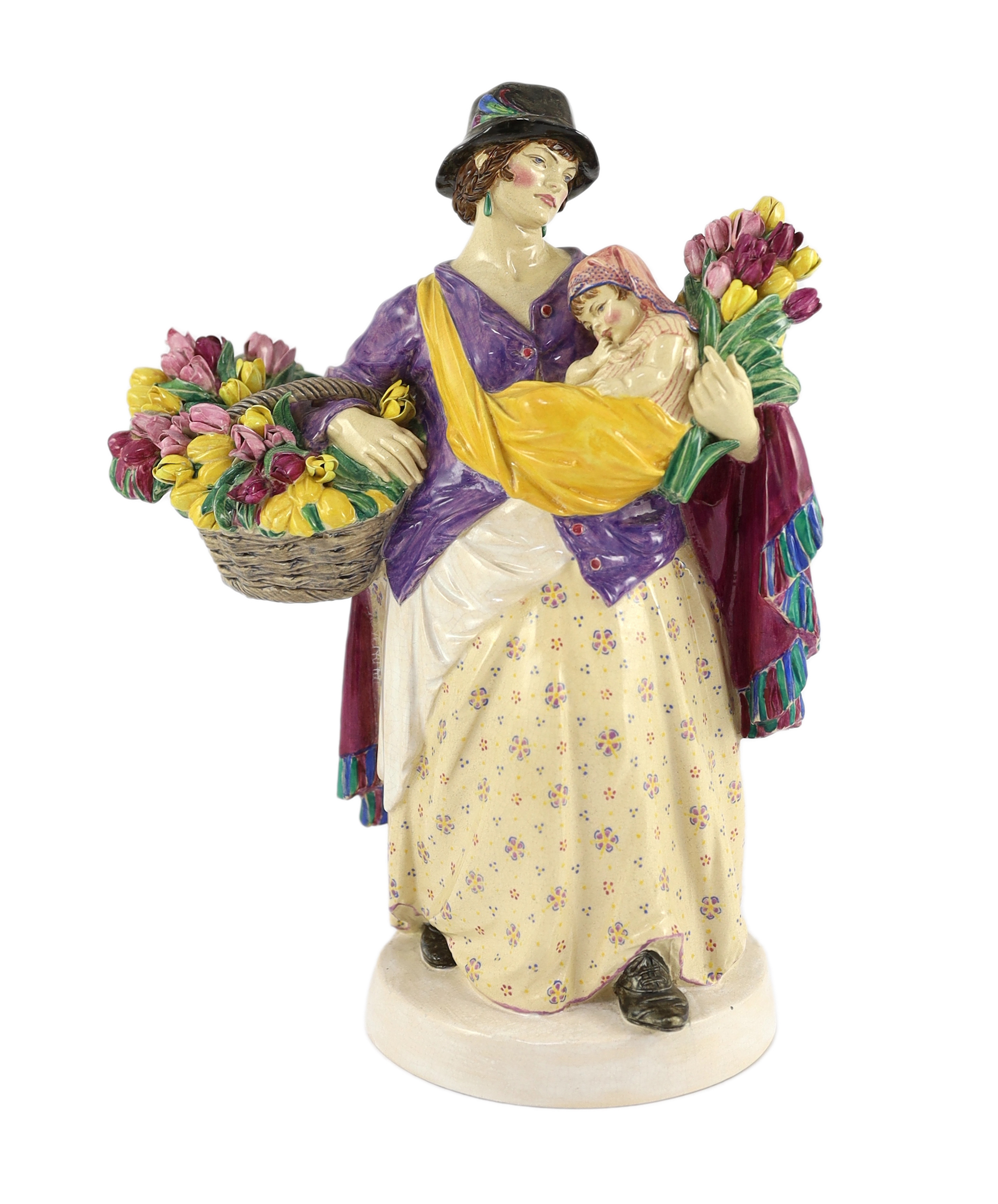 Charles Vyse (1882-1971) - a Chelsea Pottery figure, 'The Tulip Woman', the circular underside inscribed with monograms CV, Chelsea and dated 1924, 26cm high